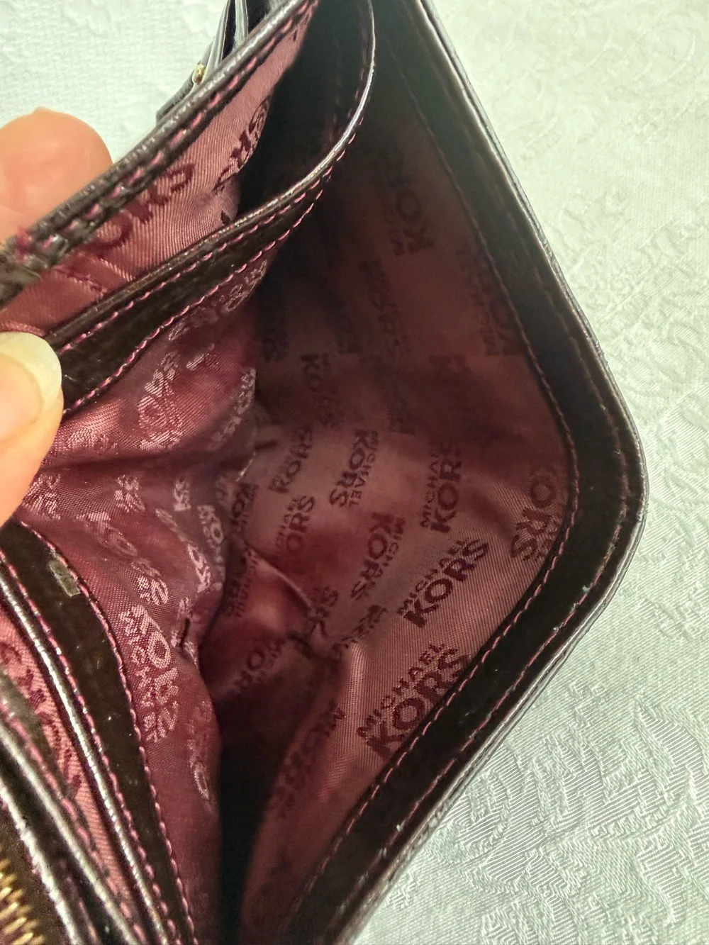 Michael Kors Burgundy patent bifold wallet with Gold Studs